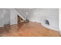 Hardwood floor living room with a fireplace and built-in shelving at 10426 N 11Th St # 3, Phoenix, AZ 85020