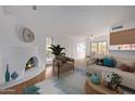 Bright living room features a fireplace, hardwood floors, and a neutral color scheme at 10426 N 11Th St # 3, Phoenix, AZ 85020