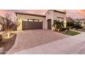 Single-story home with a two-car garage and attractive landscaping at 1175 E Copper Holw, Queen Creek, AZ 85140