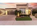 Beautiful single-story home with a landscaped front yard and a two-car garage at 1175 E Copper Holw, Queen Creek, AZ 85140