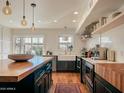 Bright kitchen boasts stainless steel appliances, a large island, and an open floor plan at 1425 E Desert Cove Ave # 24, Phoenix, AZ 85020