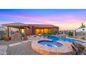 Relaxing pool and spa with a gazebo, creating a private oasis at 19711 W Georgia Ave, Litchfield Park, AZ 85340