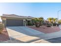 Single-story home with a tile roof and desert landscaping at 21806 N Aztec Ct, Sun City West, AZ 85375