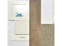 Image showcases flooring, countertop, and cabinet samples for homebuyers at 23048 E Watford Dr, Queen Creek, AZ 85142