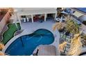 Stunning backyard with a pool, patio, and putting green at 2315 S 173Rd Dr, Goodyear, AZ 85338
