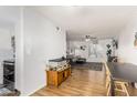 Open dining area with wood floors and view into living room at 2548 W Monte Cristo Ave, Phoenix, AZ 85023