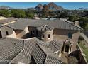 Housetop view shows a unique architectural design with a stone turret at 3804 E Camelback Rd, Phoenix, AZ 85018