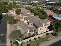 Wide aerial showcasing the home's size and surrounding neighborhood at 3804 E Camelback Rd, Phoenix, AZ 85018