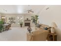 Spacious living room featuring a fireplace and large windows at 563 W Champagne Dr, Chandler, AZ 85248