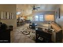 Open concept living room with kitchen views and tile floors at 650 N Hawes Rd # 4726, Mesa, AZ 85207