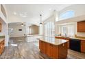 Spacious kitchen with island, granite countertops, and stainless steel appliances at 7869 W Kristal Way, Glendale, AZ 85308