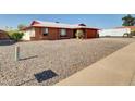 House exterior showcasing landscaping and a gravel driveway at 10329 W Griswold Rd, Peoria, AZ 85345