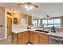 Modern kitchen with light wood cabinets and granite countertops at 11022 N Indigo Dr # 127, Fountain Hills, AZ 85268