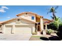 Two-story house with three-car garage and landscaped front yard at 11101 W Sieno Pl, Avondale, AZ 85392