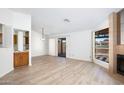 Light and bright living room with fireplace and sliding glass doors at 12234 S Shoshoni Dr, Phoenix, AZ 85044