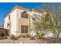 Two-story house with a white garage door and landscaping at 1340 S 232Nd Ave, Buckeye, AZ 85326