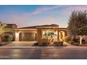 Beautiful single-story home featuring manicured landscaping, a paver driveway, and a two-car garage at 1457 E Copper Holw, Queen Creek, AZ 85140