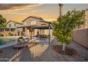 Relaxing backyard oasis with a pool, gazebo and citrus tree at 1723 E Cotton Ct, Gilbert, AZ 85234