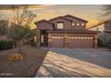 Two-story house with a three-car garage and desert landscaping at 1723 E Cotton Ct, Gilbert, AZ 85234