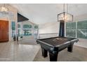 Entryway with a pool table and view into the kitchen at 1931 W Mulberry Dr, Chandler, AZ 85286