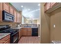 Kitchen with island, stainless steel appliances, and wood floors at 2331 W Kristina Ave, San Tan Valley, AZ 85144