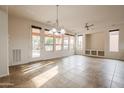 Bright dining area with tile floors and access to backyard at 28837 N 127Th Ave, Peoria, AZ 85383