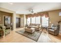 Light and airy living room with hardwood floors, and comfortable seating at 41604 N Cedar Chase Rd, Anthem, AZ 85086