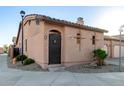 Charming single-story home featuring desert landscaping, tile roof, private drive, and an attached two-car garage at 4511 W Valencia Dr, Laveen, AZ 85339