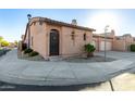 Charming single-story home featuring desert landscaping, tile roof, private drive, and an attached two-car garage at 4511 W Valencia Dr, Laveen, AZ 85339