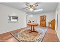 Dining room with round table, area rug, and wooden hutch at 526 N Hobson Plz, Mesa, AZ 85203