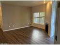 Spacious living room with hardwood floors and a fireplace at 600 W Grove Pkwy # 2067, Tempe, AZ 85283