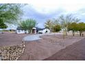 House exterior view showcasing landscaping and driveway at 6118 N 183Rd Ave, Waddell, AZ 85355