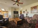 Relaxing living room with leather furniture and hardwood floors at 650 N Hawes Rd # 4820, Mesa, AZ 85207