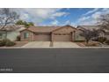 Two-unit stucco home with two-car garages and landscaping at 6610 E University Dr # 157, Mesa, AZ 85205