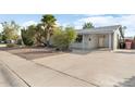 House exterior with a covered entryway and driveway at 6725 E Moreland St, Scottsdale, AZ 85257