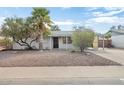 White brick ranch home with palm trees and rock landscaping at 6725 E Moreland St, Scottsdale, AZ 85257