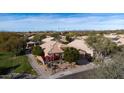 An aerial view showing the desert landscaping of the single-story tan home and tile roof at 7654 E Quill Ln, Scottsdale, AZ 85255