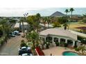 Aerial view of the condo complex featuring mature landscaping, a pool and views of Camelback Mountain at 7777 E 2Nd St # 101, Scottsdale, AZ 85251