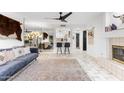 Bright living room featuring a sleek fireplace, mirrored wall, and tiled floors at 7777 E 2Nd St # 101, Scottsdale, AZ 85251