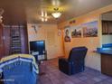 Living room with tiled floors, southwestern decor and comfortable seating at 8221 E Garfield St # L122, Scottsdale, AZ 85257