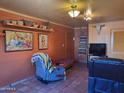 Spacious living room featuring southwestern art and comfortable seating at 8221 E Garfield St # L122, Scottsdale, AZ 85257