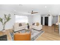 Bright and airy living room with hardwood floors and modern furniture at 8626 E Montebello Ave, Scottsdale, AZ 85250