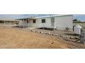 Side exterior of a home with a covered parking area at 9431 E Coralbell Ave # 198, Mesa, AZ 85208