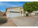 Home's exterior showcases a clean design and ample parking at 9862 E Flower Ave, Mesa, AZ 85208