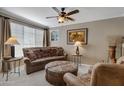 Relaxing living room with leather furniture and southwestern decor at 10101 N Arabian Trl # 2052, Scottsdale, AZ 85258