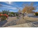 Landscaped front yard with drought-tolerant plants and gravel at 10625 W Deanne Dr, Sun City, AZ 85351