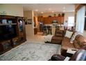 Spacious living room with L-shaped sectional sofa and large TV at 1414 N Estrada --, Mesa, AZ 85207