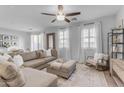 Spacious living room with sectional sofa and stylish decor at 1448 N 80Th Dr, Phoenix, AZ 85043