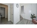 Entryway with powder room and staircase at 15718 W Polk St, Goodyear, AZ 85338