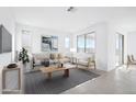 Bright and airy living room with large windows and comfortable seating at 15790 W Hackamore Dr, Surprise, AZ 85387